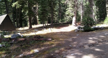 The trail comes out on this dirt road beside the A-frame.