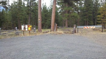 Split the uprights. Where the singletrack comes onto the road at the west end of the Rimrock Trail.