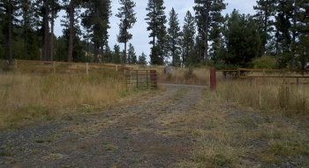 The entrance gate, as seen from the parking log. 
