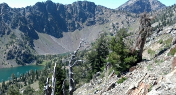 Top of the Twin Lakes Trail, with the lakes seen lower left and the semblance of a trail clinging to the ridge on the right.