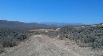 View to the west of the Elkhorn Mountains and the Oregon Trail Interpretive Center perched on the hilltop.