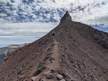 A trail continues up toward Twin Peaks from Legore Lake.