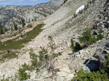 The trail drops down abruptly through the rocks after Pop Pass.