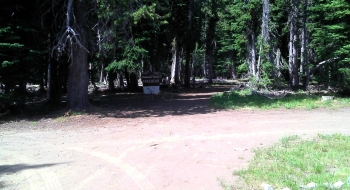 At Russel Mountain Lookout there is a Trailhead sign entering back onto singletrack to the west.