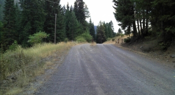This cattleguard and where the power lines cross the road may (or may not) be a legal exit/entrance to the trail. You would have to hop the fence here and follow power lines down to the river then find a food fording place.