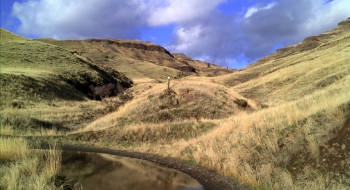 The trail entrance as seen from the road to Dug Bar