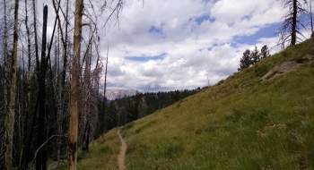 The descending begins with the Sawtooth Mountains as a backdrop. 