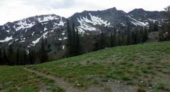 The trail drops down to Blue Creek Saddle.