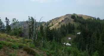 The sidehill wilderness section seen from Huckleberry Mountain. The Baker Trail is faintly visible in the middle of the picture, traversing across the slope.