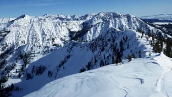 Looking southeast from the ridge with Red Mountain and Krag Peak visible in the distant background.