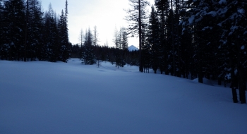 Snowmobiling up the road, the pyramid of Burger comes into view in the early morning. 