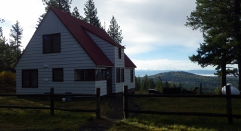 Summit Guard Station, with Spring Mountain in the background.