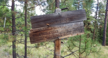 Trail sign just off the road on the east end of the trail. 