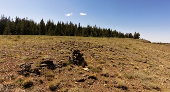 Official start of the Storm Lake Trail at the cairn marking the Goat Creek Trail and end of the Huckleberry Mountain Trail.