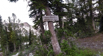 Trail sign posted on either side of Traverse Lake area.